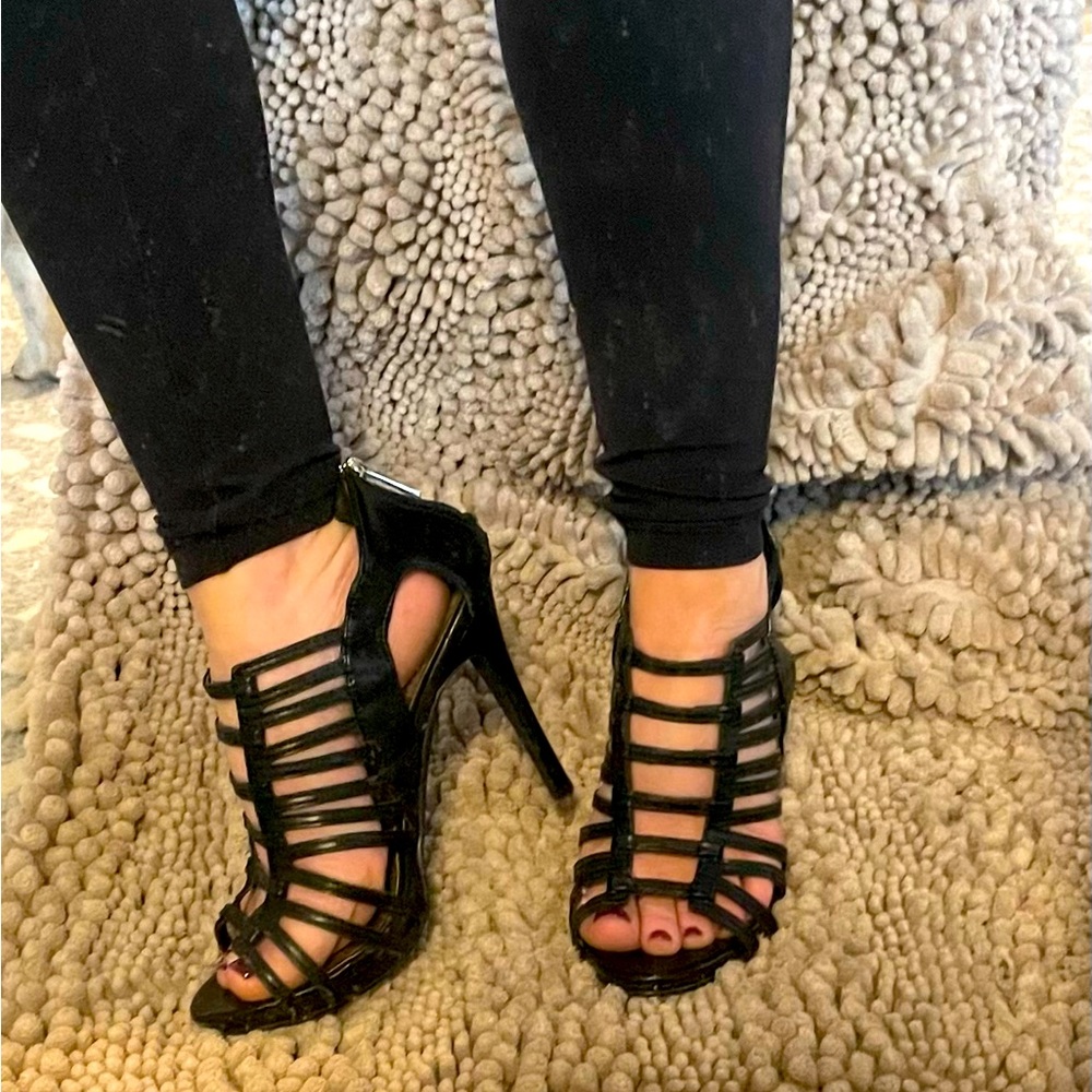 Black strappy heels size 6 zip closure back. Worn once.